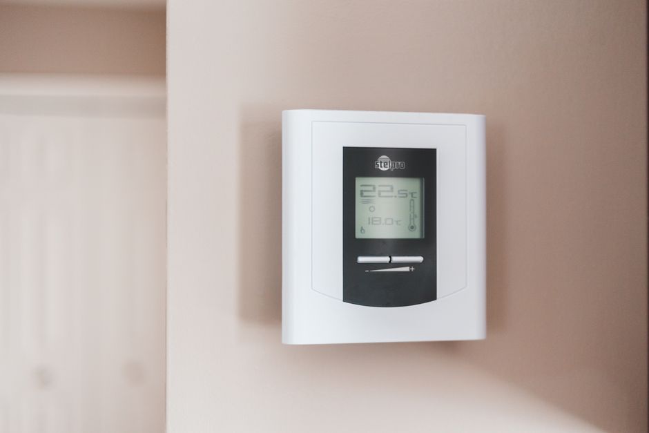 Home thermostat on a wall